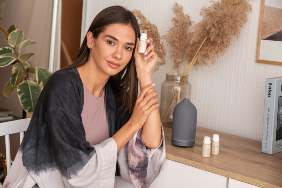 Woman doing home manicure nail file hand cream