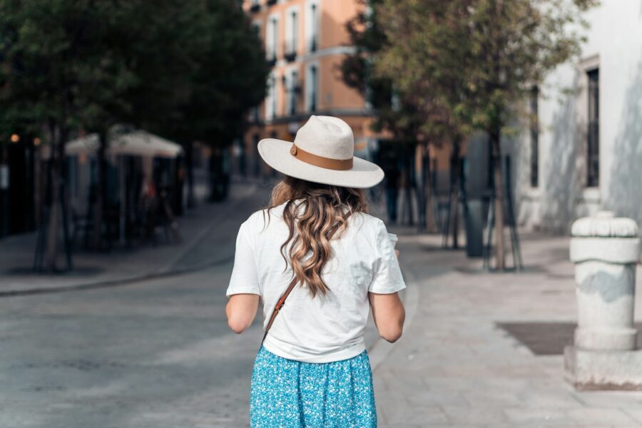 Woman straw hat sunglasses summer street