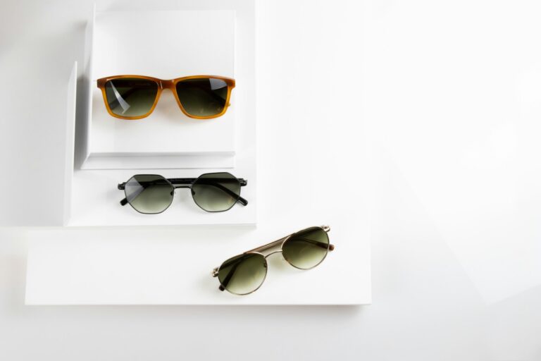 Flatlay straw hat sunglasses woven bag sunglasses display