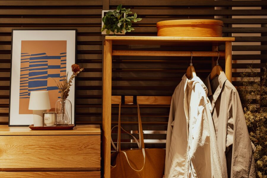 Organized apartment entryway bench coat hooks rug