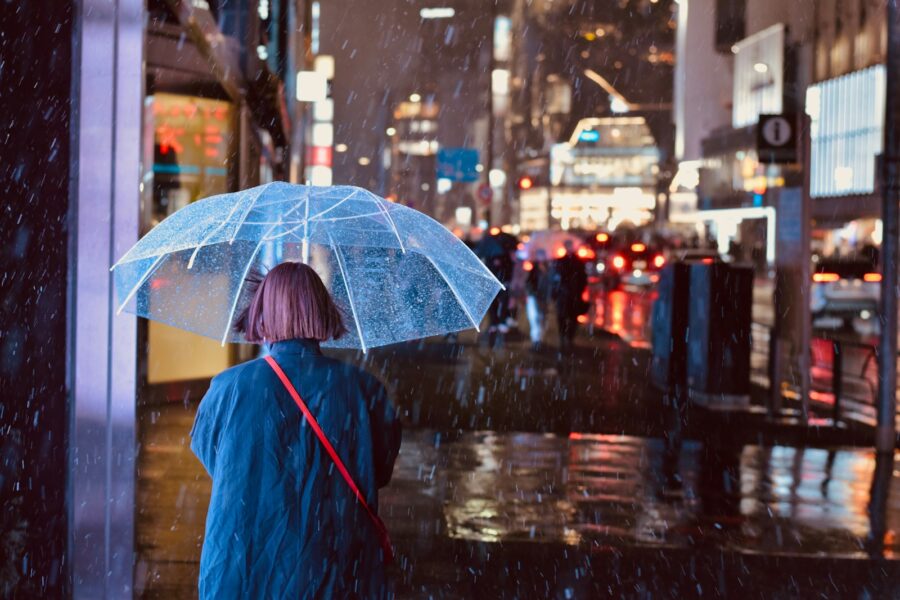 Compact umbrella rain city street