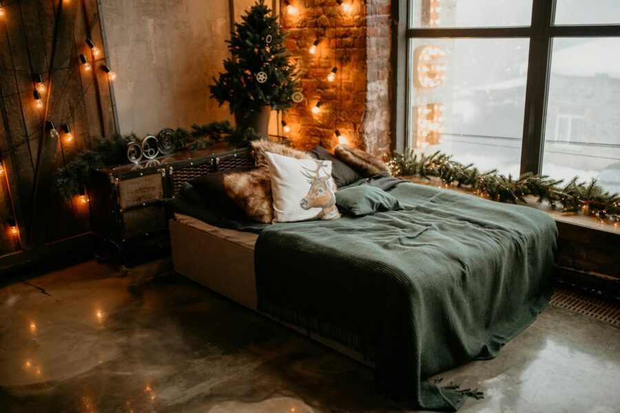 Cozy autumn bedroom warm lighting blankets pillows