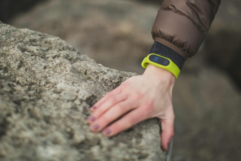 Fitness tracker wristband close hand running shoes