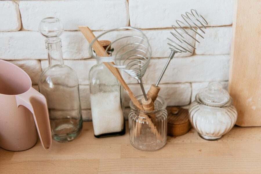Small home kitchen wooden utensils glass containers