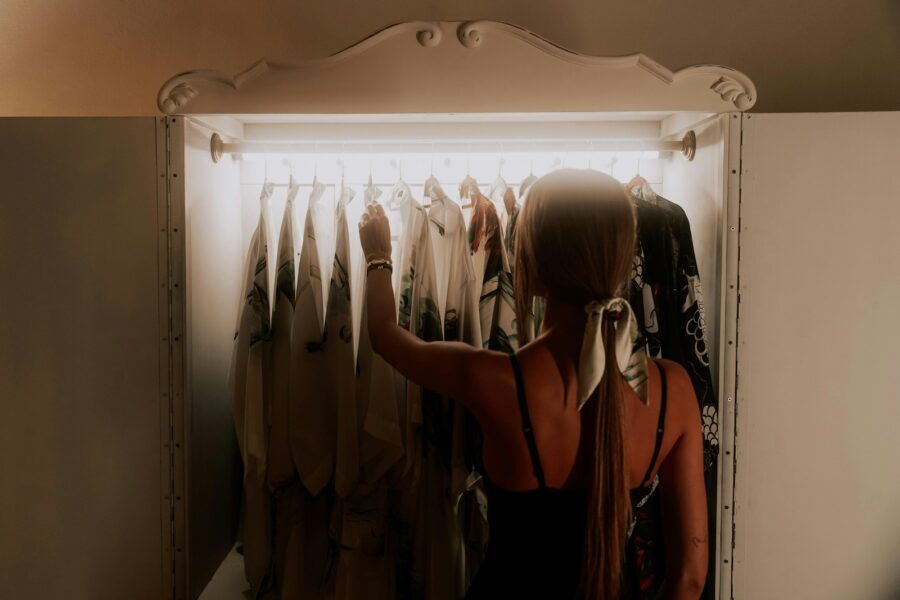 Woman getting dressed front wardrobe