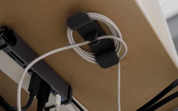 Smart cable organizers that keep desks and bags under control