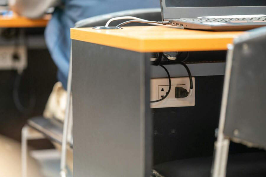 Smart power strip wooden desk cables
