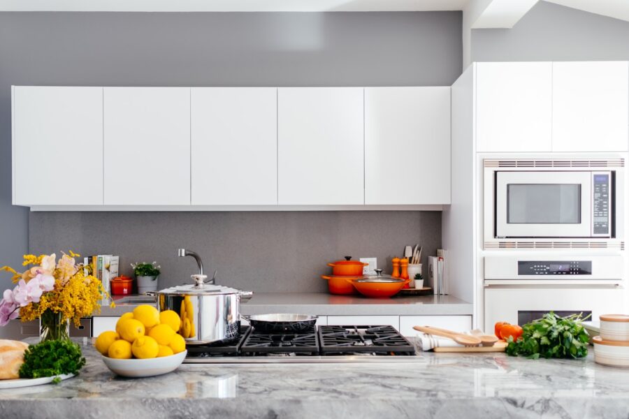 modern white kitchen with marble island